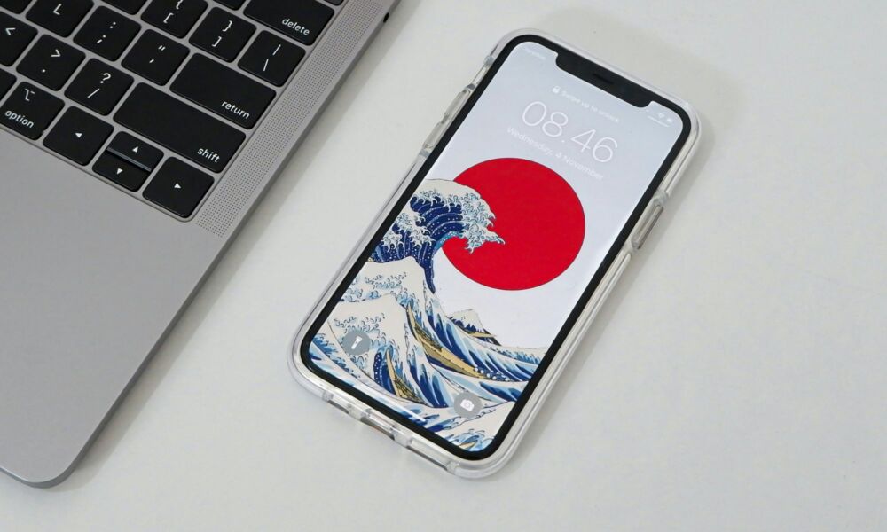 iPhone with Japan wallpaper by MacBook